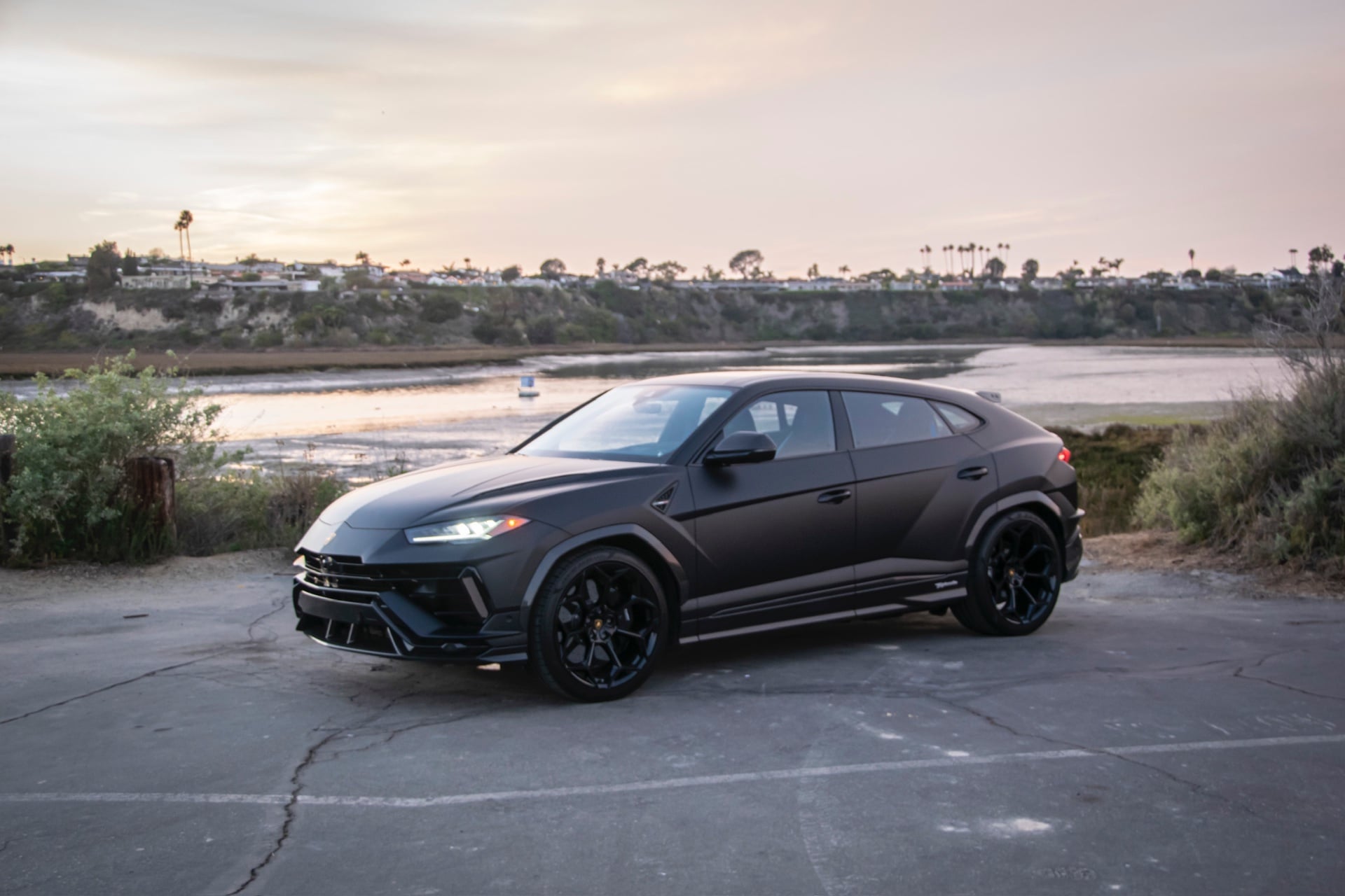 Matte black Lamborghini Urus Performante parked on a Los Angeles street in autumn
